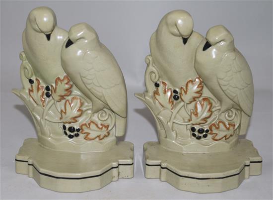 A pair of Poole Pottery Lovebirds bookends and another similar bookend, largest 7.75in.